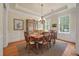 Formal dining room with a classic chandelier and many windows, perfect for entertaining at 1781 Tennyson # 6, Mount Pleasant, SC 29466