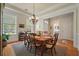 Elegant dining room featuring a chandelier, natural light, and classic decor at 1781 Tennyson # 6, Mount Pleasant, SC 29466
