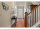 Bright foyer featuring hardwood floors, staircase, and console table at 1781 Tennyson # 6, Mount Pleasant, SC 29466