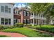 Charming two-story brick home with double porches, black shutters, and professionally landscaped yard at 1781 Tennyson # 6, Mount Pleasant, SC 29466