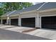 Attached garages with dark doors and concrete driveways provide ample parking and storage at 1781 Tennyson # 6, Mount Pleasant, SC 29466