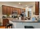 Kitchen with wooden cabinets, a breakfast bar, stainless appliances, and views into another room at 1781 Tennyson # 6, Mount Pleasant, SC 29466