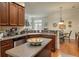 Kitchen featuring wood cabinetry, stainless steel appliances, and an open layout into living areas at 1781 Tennyson # 6, Mount Pleasant, SC 29466