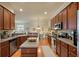 Spacious kitchen with an island, hardwood floors, stainless steel appliances and an adjacent dining area at 1781 Tennyson # 6, Mount Pleasant, SC 29466