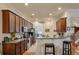 Well-equipped kitchen with stainless appliances, wooden cabinets and barstool seating at 1781 Tennyson # 6, Mount Pleasant, SC 29466