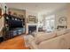 Bright living room with fireplace, french doors to the outside, and hardwood flooring at 1781 Tennyson # 6, Mount Pleasant, SC 29466