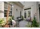 Cozy outdoor patio with seating, garden plants, and natural light filtering through the windows at 1781 Tennyson # 6, Mount Pleasant, SC 29466