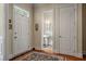 Entryway and view into a powder room with pedestal sink, wooden floors, and a bright ambiance at 1781 Tennyson # 6, Mount Pleasant, SC 29466