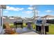 Well-maintained backyard features multiple grills, chairs, and a neatly fenced perimeter at 179 Darby Meadow Ln, Ridgeville, SC 29472