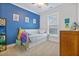 Bedroom with carpet flooring, blue accent wall and lots of natural light at 179 Darby Meadow Ln, Ridgeville, SC 29472