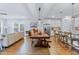 Spacious kitchen with a large island, wooden bar stools, granite countertops and an adjacent living area at 179 Darby Meadow Ln, Ridgeville, SC 29472