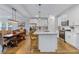 Open-concept kitchen with stainless steel appliances, a center island, granite countertops, and hardwood floors at 179 Darby Meadow Ln, Ridgeville, SC 29472