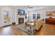 Inviting living room with a cozy fireplace, plush sofa, and large windows for natural light at 179 Darby Meadow Ln, Ridgeville, SC 29472