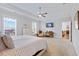 Open main bedroom with tray ceilings, lots of natural light and carpet flooring at 179 Darby Meadow Ln, Ridgeville, SC 29472