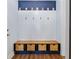 Stylish mud room with built-in storage, wooden bench, and decorative wall accents at 179 Darby Meadow Ln, Ridgeville, SC 29472