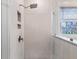 Walk in shower with glass surround, shampoo niches and decorative window at 179 Darby Meadow Ln, Ridgeville, SC 29472
