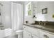 Classic bathroom featuring a shower over the tub, tile floor, and single sink at 1872 Rifle Range Rd, Mount Pleasant, SC 29464