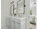 Modern bathroom with double vanity, sleek fixtures, and a view into the adjacent bedroom at 1872 Rifle Range Rd, Mount Pleasant, SC 29464