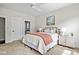 Bright bedroom has soft carpet, a comfy bed, and ensuite bath at 1872 Rifle Range Rd, Mount Pleasant, SC 29464