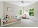 Bright bedroom featuring a built-in bed and a cozy reading nook at 1872 Rifle Range Rd, Mount Pleasant, SC 29464