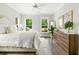 Serene bedroom with a soft color palette, large windows offering natural light, and a well-appointed dresser at 1872 Rifle Range Rd, Mount Pleasant, SC 29464