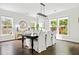 Elegant dining room with a large table, classic decor, and ample natural light, ideal for Gathering meals and gatherings at 1872 Rifle Range Rd, Mount Pleasant, SC 29464