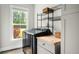 Modern laundry room with a washer, dryer, and ample storage space at 1872 Rifle Range Rd, Mount Pleasant, SC 29464