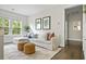 Bright living room features a comfortable white couch, stylish rug, and decor at 1872 Rifle Range Rd, Mount Pleasant, SC 29464