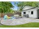 Spacious backyard patio featuring comfortable seating, outdoor kitchen space, and play area perfect for entertaining at 1872 Rifle Range Rd, Mount Pleasant, SC 29464