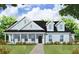 Charming single-story home with a welcoming front porch and classic architectural details at 1964 Central Ave, Summerville, SC 29483