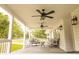 Inviting back porch featuring neutral furniture, ceiling fans, and stylish lighting, perfect for outdoor relaxation at 201 Welles Ln, Walterboro, SC 29488