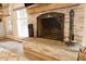 Cozy fireplace with a decorative screen and stone hearth, perfect for adding warmth to your living space at 201 Welles Ln, Walterboro, SC 29488