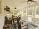 Relaxing screened porch with ceiling fans, ample seating, and a view of the backyard at 201 Welles Ln, Walterboro, SC 29488