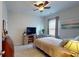 Relaxing bedroom with a ceiling fan, modern TV, and natural light at 2022 Elvington Rd, Johns Island, SC 29455