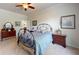Relaxing bedroom with neutral colors, carpet, and a wrought iron bed frame at 2022 Elvington Rd, Johns Island, SC 29455