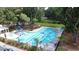 Aerial view of a community pool surrounded by lush trees, offering a refreshing escape for residents at 2022 Elvington Rd, Johns Island, SC 29455