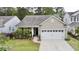 Charming single Gathering home featuring a two-car garage and well-maintained landscaping at 2022 Elvington Rd, Johns Island, SC 29455