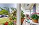 Inviting front porch features comfortable seating and colorful flowers, creating a cozy outdoor space at 2022 Elvington Rd, Johns Island, SC 29455