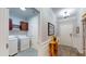 Hallway with utility closet and entry. Features light gray paint and nice flooring at 2022 Elvington Rd, Johns Island, SC 29455