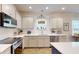 Bright kitchen with stainless appliances, white cabinets, and a kitchen island at 2022 Elvington Rd, Johns Island, SC 29455