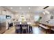 Bright and open kitchen featuring a large island and dining area at 2022 Elvington Rd, Johns Island, SC 29455
