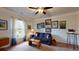Bright living room featuring a comfortable sofa, a ceiling fan, and lots of natural light at 2022 Elvington Rd, Johns Island, SC 29455