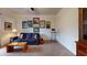 Cozy living room featuring a comfortable sofa, carpeted floors, and decorative wall decor at 2022 Elvington Rd, Johns Island, SC 29455