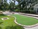Community recreation area with a bocce ball court, putting green, and playground, perfect for outdoor fun and socializing at 2022 Elvington Rd, Johns Island, SC 29455