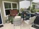 Cozy screened porch featuring outdoor seating and vibrant potted plants, perfect for relaxing and entertaining guests at 2022 Elvington Rd, Johns Island, SC 29455