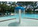 Fun splash pad area in a pool with a mushroom water feature, offering a safe and playful environment for  at 2022 Elvington Rd, Johns Island, SC 29455