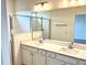 Bathroom featuring double sink vanity and a walk-in shower with glass doors at 203 Blueway Ave, Summerville, SC 29486