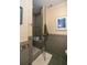 Modern bathroom features a glass enclosed shower with gray tile surround, and neutral colored walls at 2050 Wappoo Hall Rd, Charleston, SC 29412