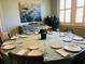 Dining room featuring a set table with elegant tableware and decorative floral centerpiece at 2050 Wappoo Hall Rd, Charleston, SC 29412