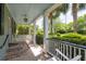 Inviting front porch with cozy swing, providing a relaxing outdoor retreat at 2050 Wappoo Hall Rd, Charleston, SC 29412